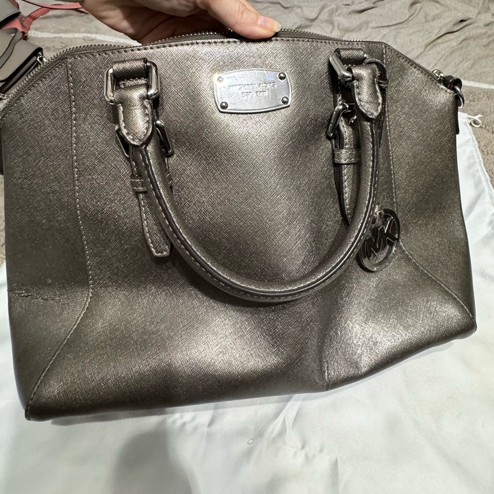 Unique silver grey purse with a slight shimmer effect. Needs cleaned inside